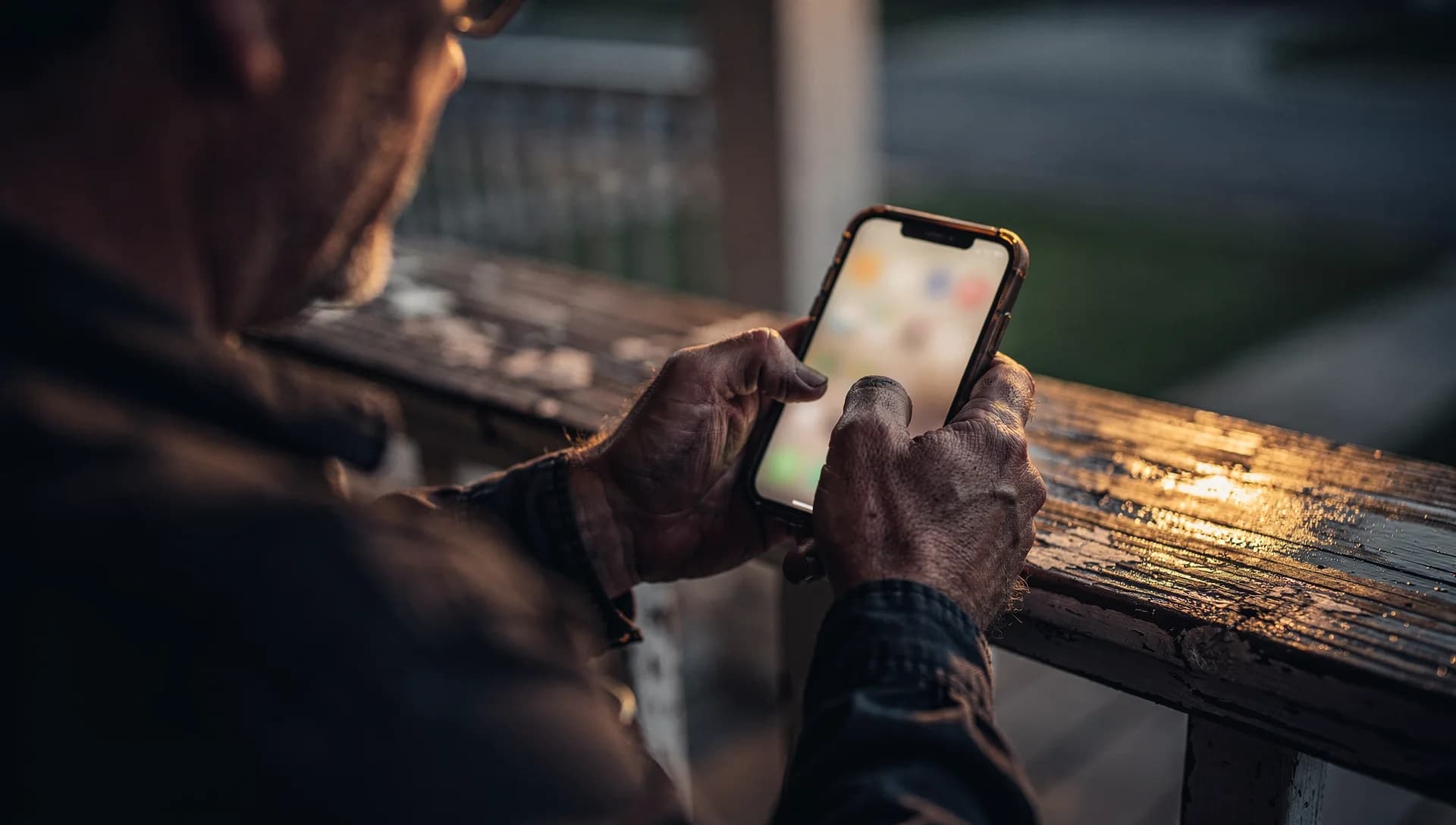Phone in hand showing an unreadable review-request glow